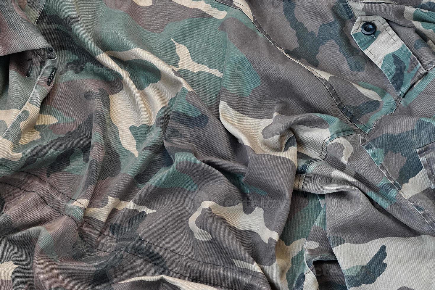 Camouflage background texture as backdrop for army and military design projects photo