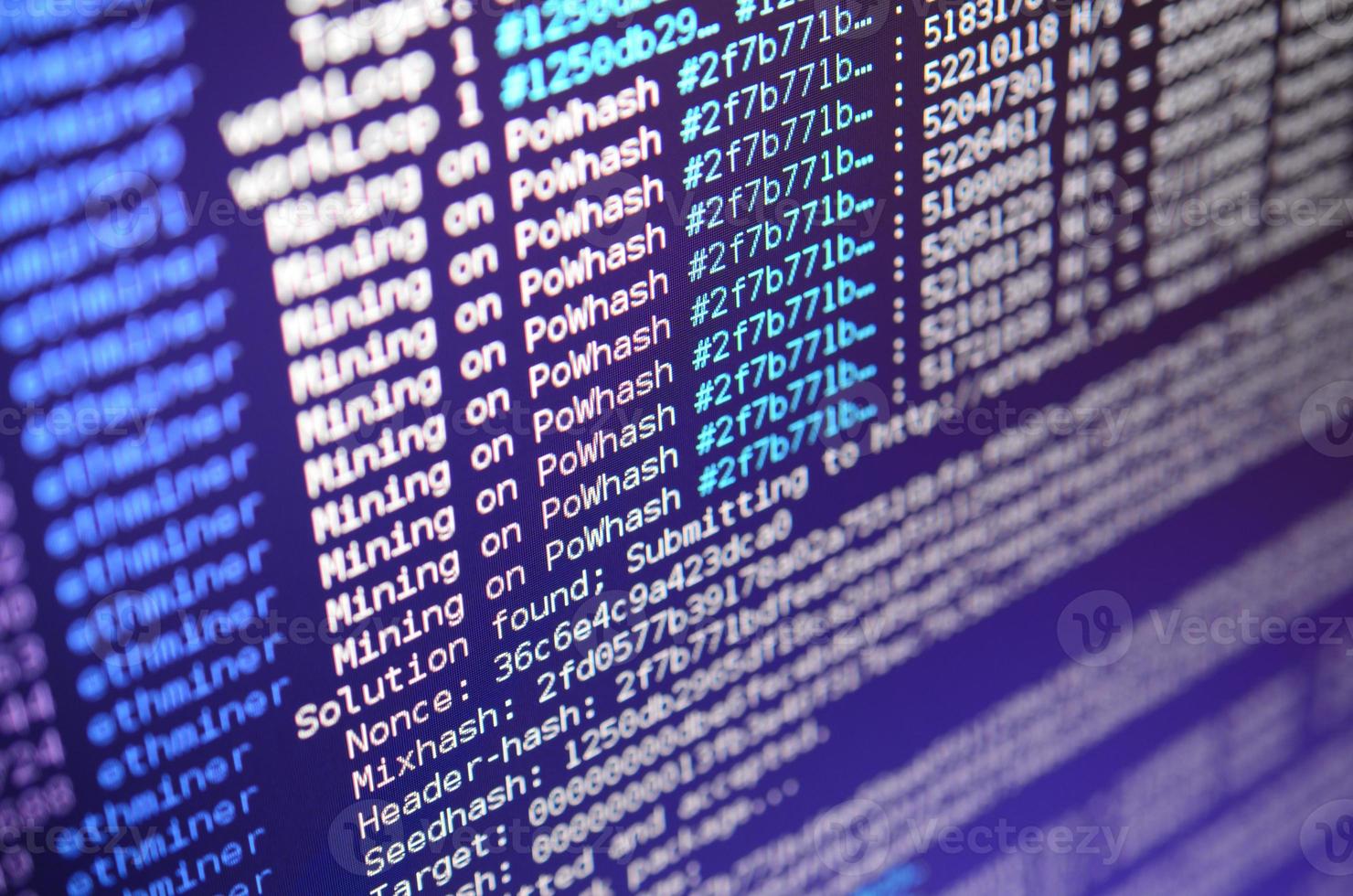 Macro snapshot of the program interface for crypto currency mining on the monitor of an office computer. The concept of mining bitcoins. The flow of information strings and data photo