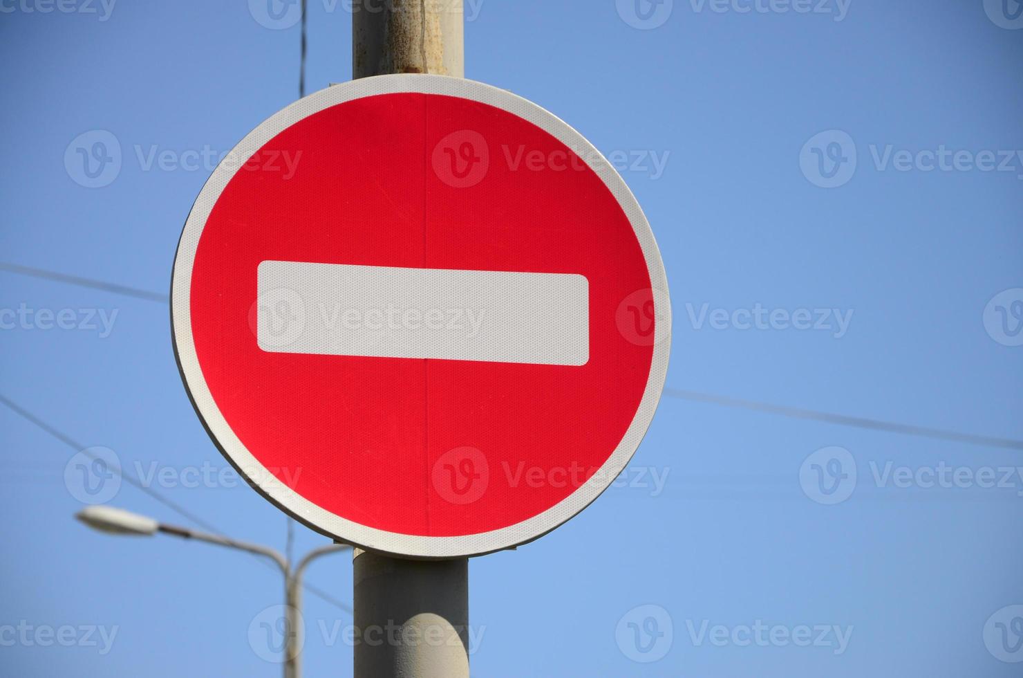 Road sign in the form of a white rectangle in a red circle. No entry photo