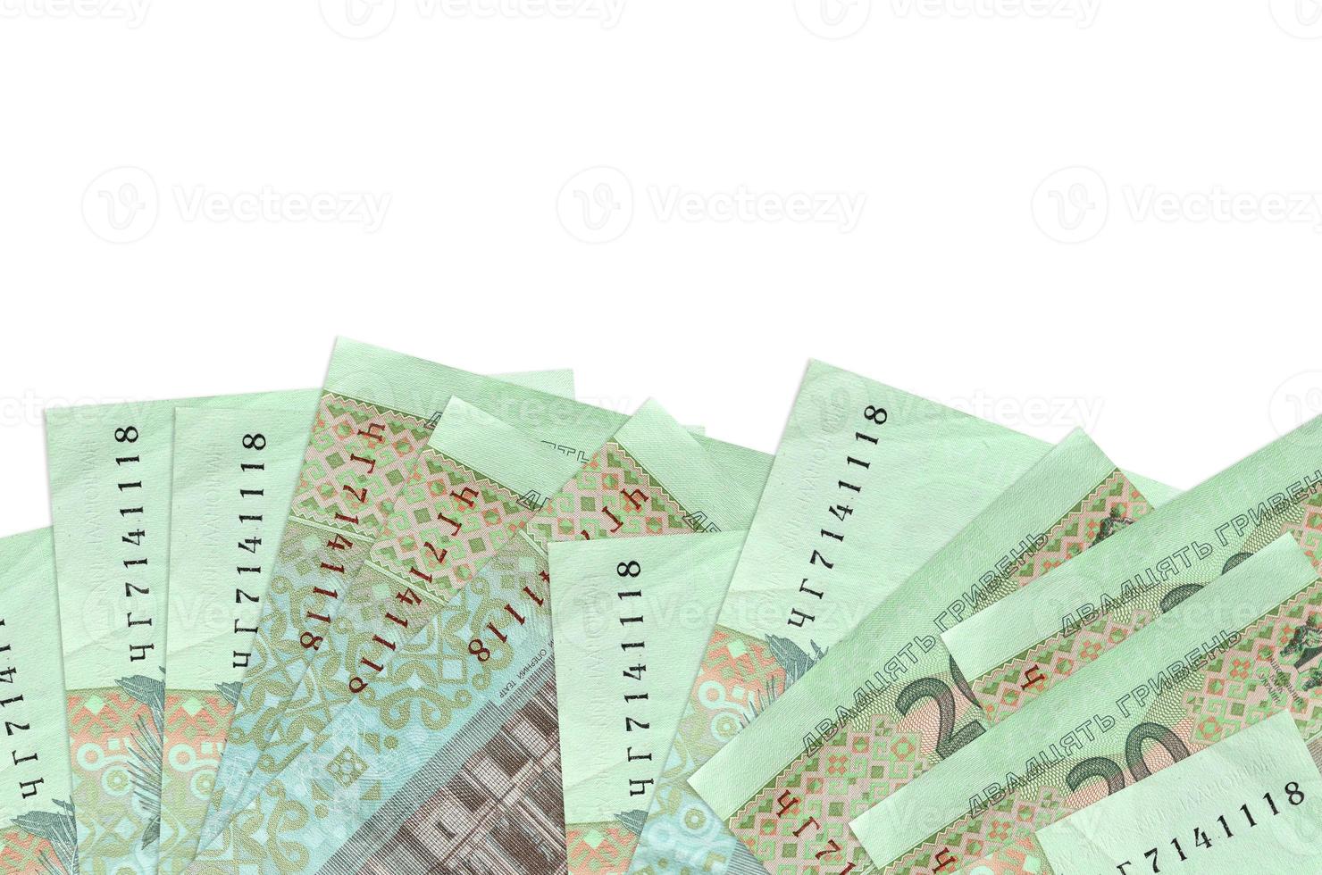 20 Ukrainian hryvnias bills lies on bottom side of screen isolated on white background with copy space. Background banner template photo