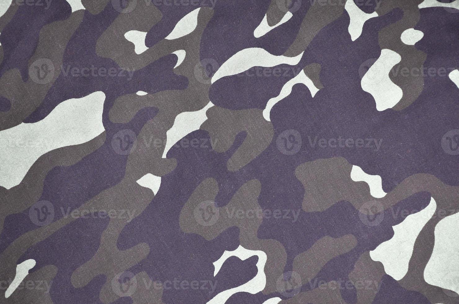 Texture of fabric with a camouflage painted in colors of the marsh. Army background image photo