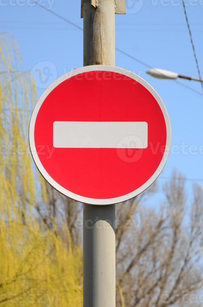 Road sign in the form of a white rectangle in a red circle. No entry photo