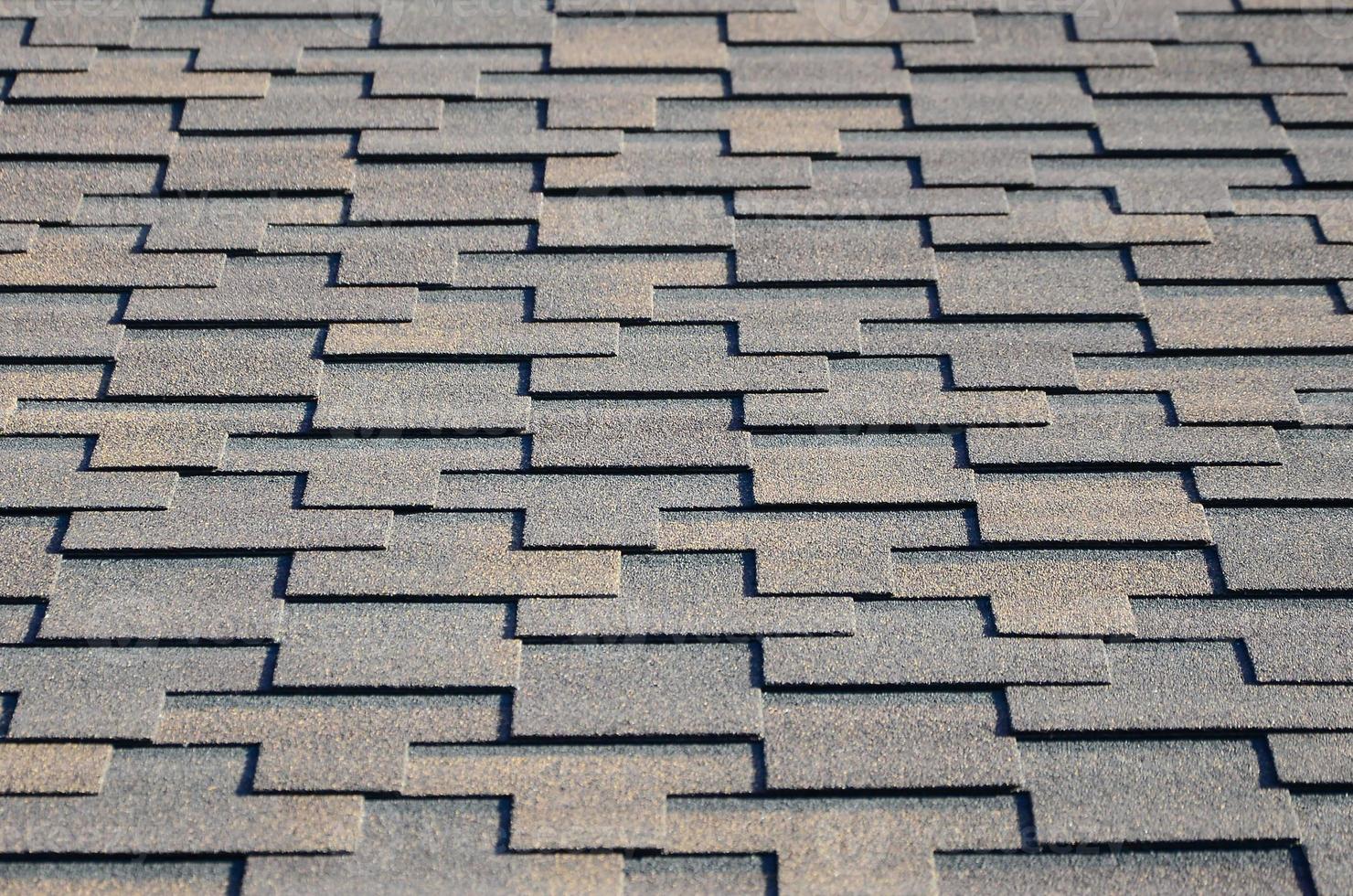 Modern roofing and decoration of chimneys. Flexible bitumen or slate shingles photo