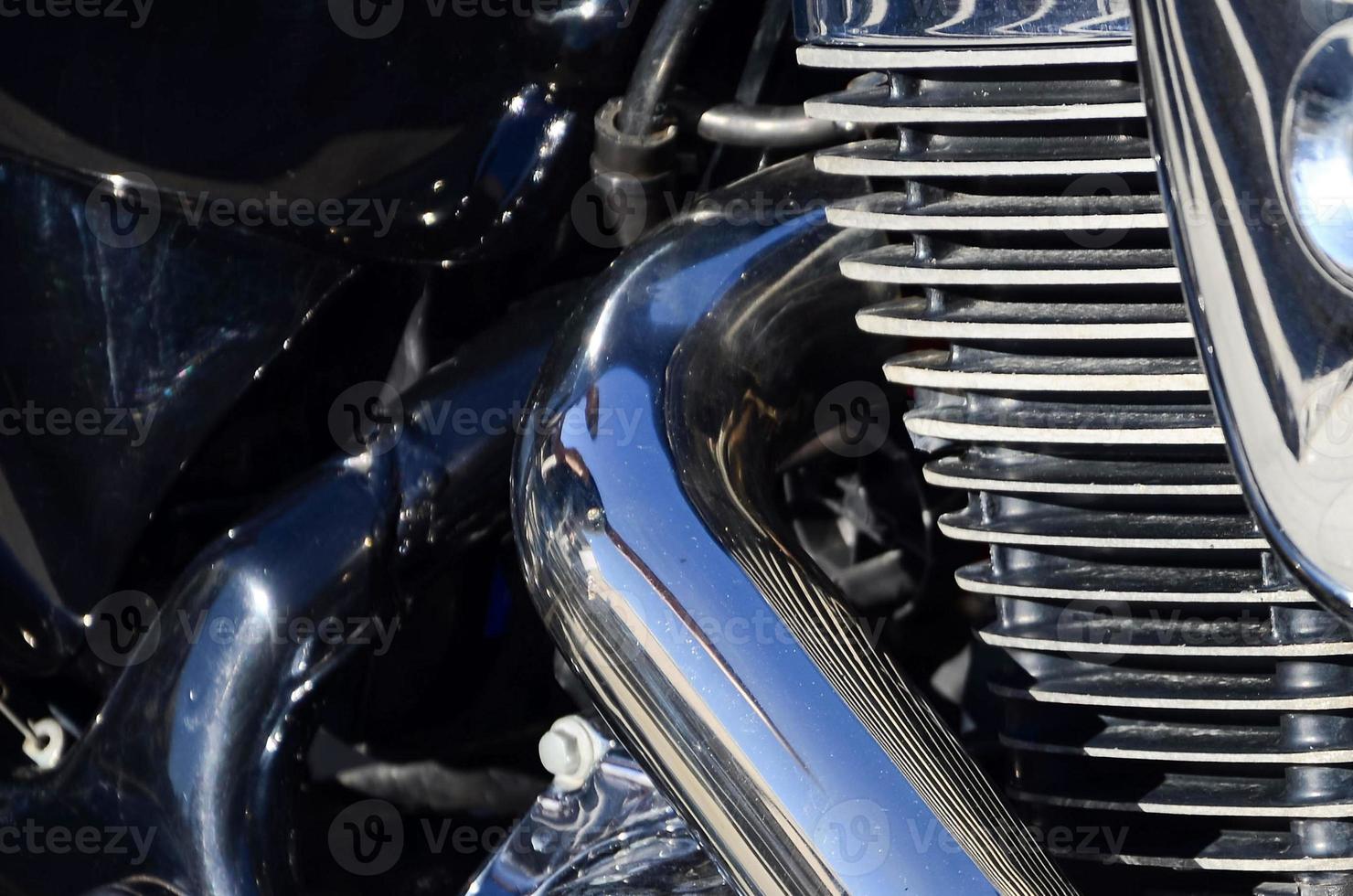 Fragment of chromed shiny body part of old classic motorbike photo