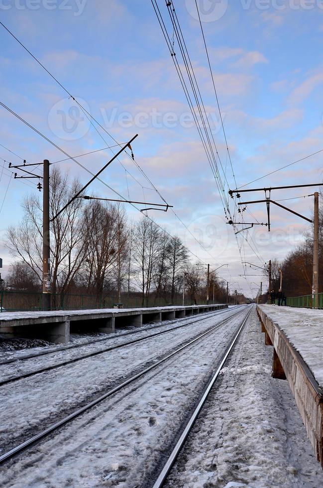 Evening winter landscape with the railway station photo