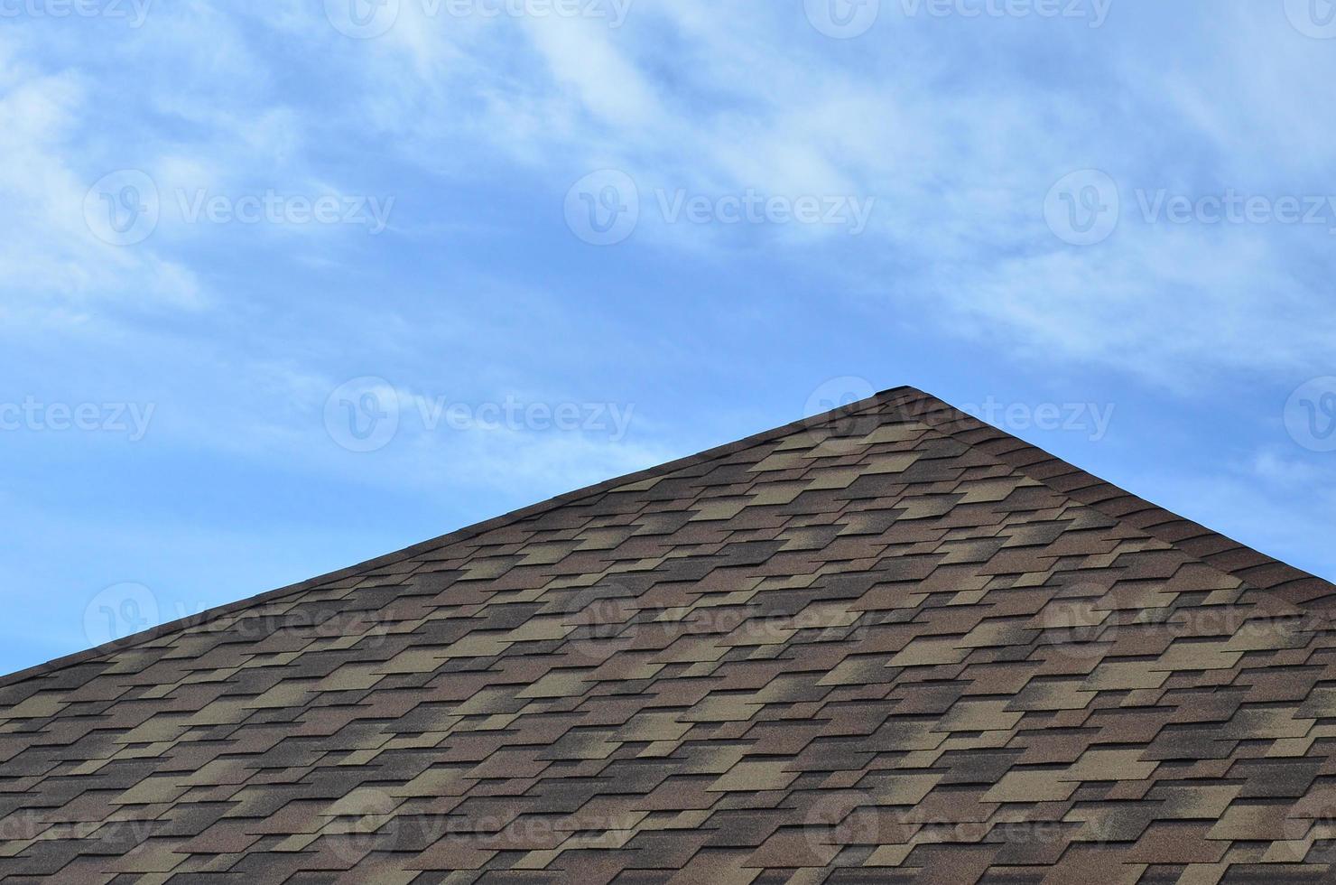 The roof covered with a modern flat bituminous waterproof coating under a blue sky photo