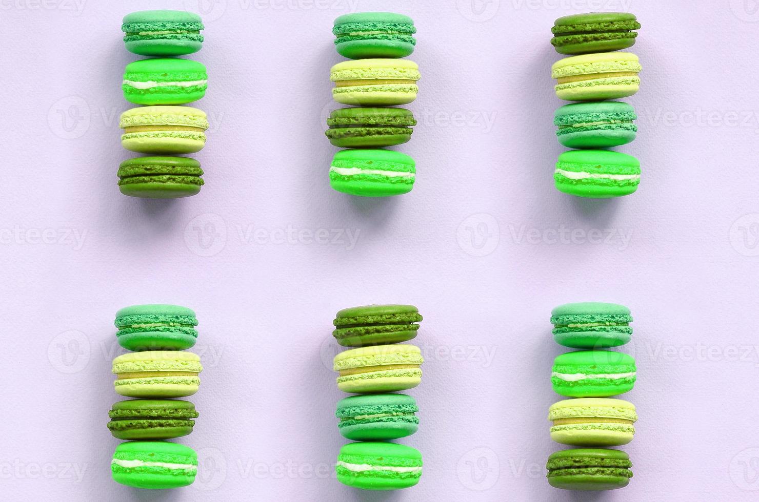 Dessert cake macaron or macaroon on trendy pastel lilac background top view photo