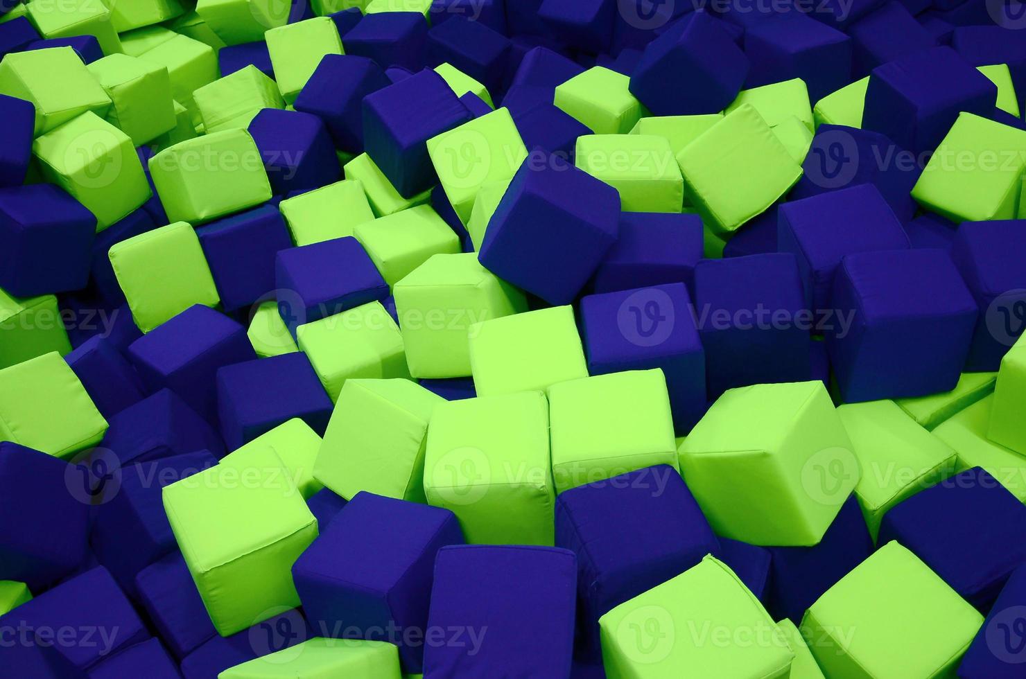 Many colorful soft blocks in a kids' ballpit at a playground photo