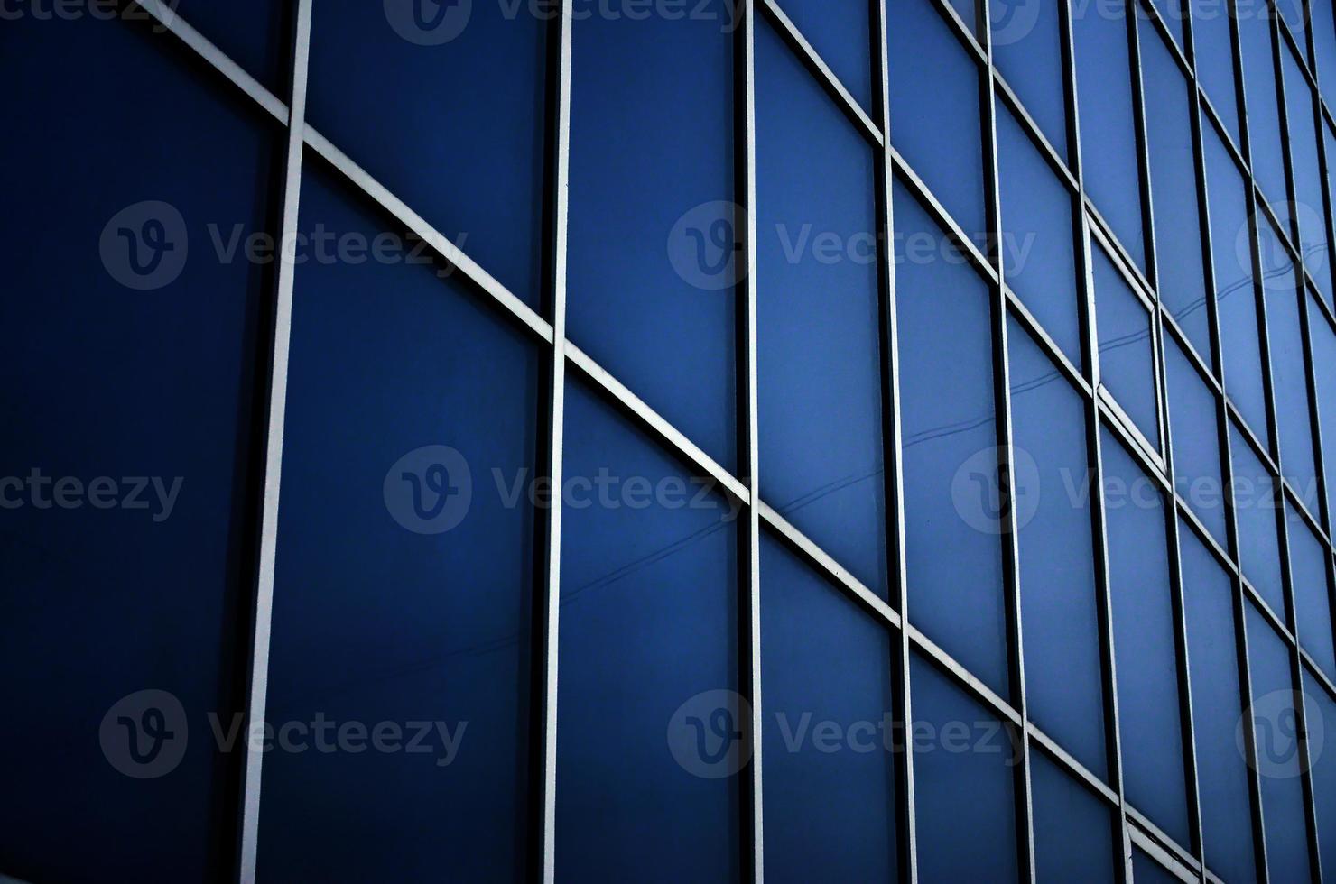 Solid blue windows of the office building. Glass wall photo