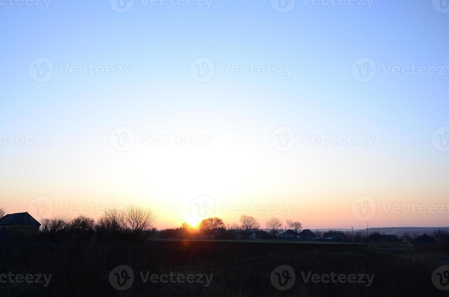 Dawn in the village. Sunrise in the suburban landscape photo