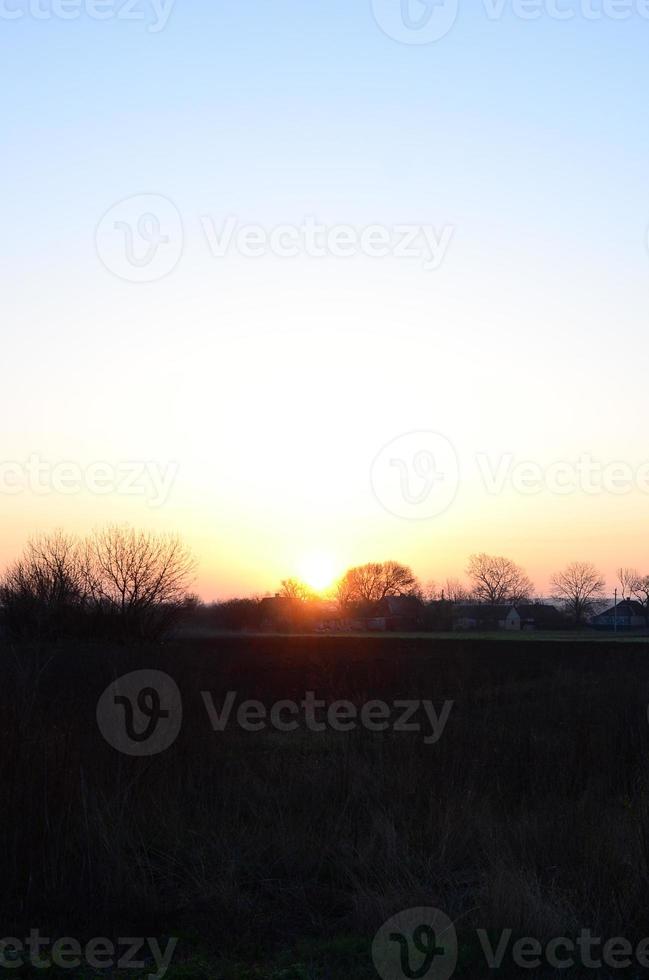 Dawn in the village. Sunrise in the suburban landscape photo