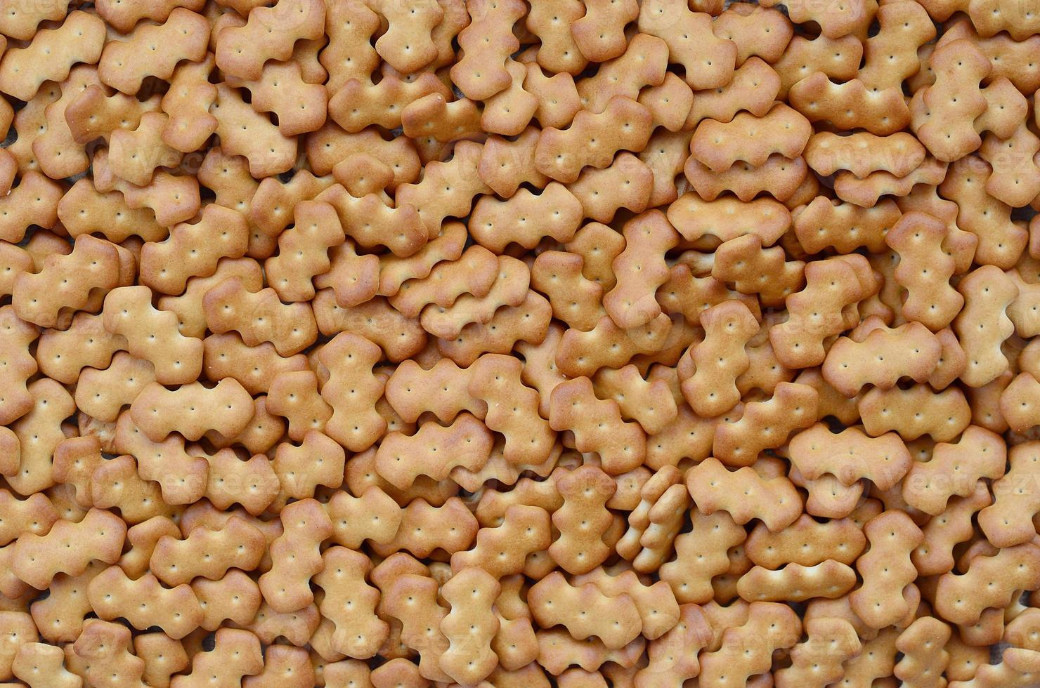 Pattern of a many yellow salted crackers photo