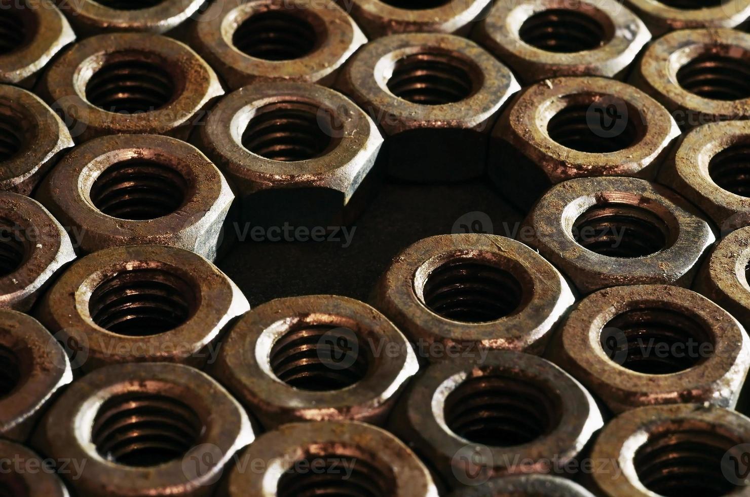 Close-up of rusty nuts photo