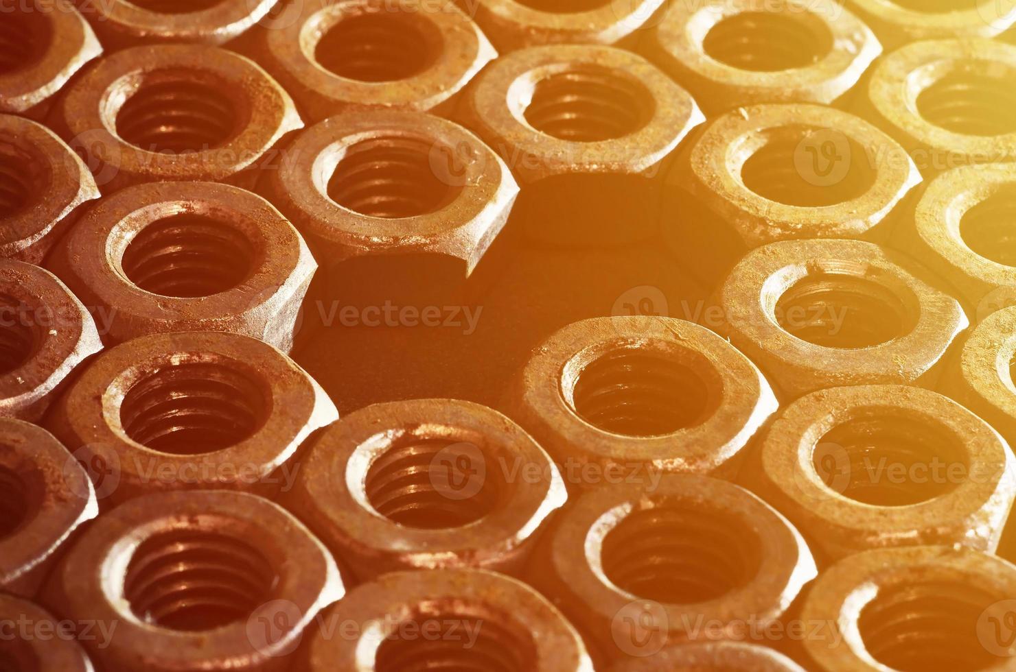 Close-up of rusty nuts photo