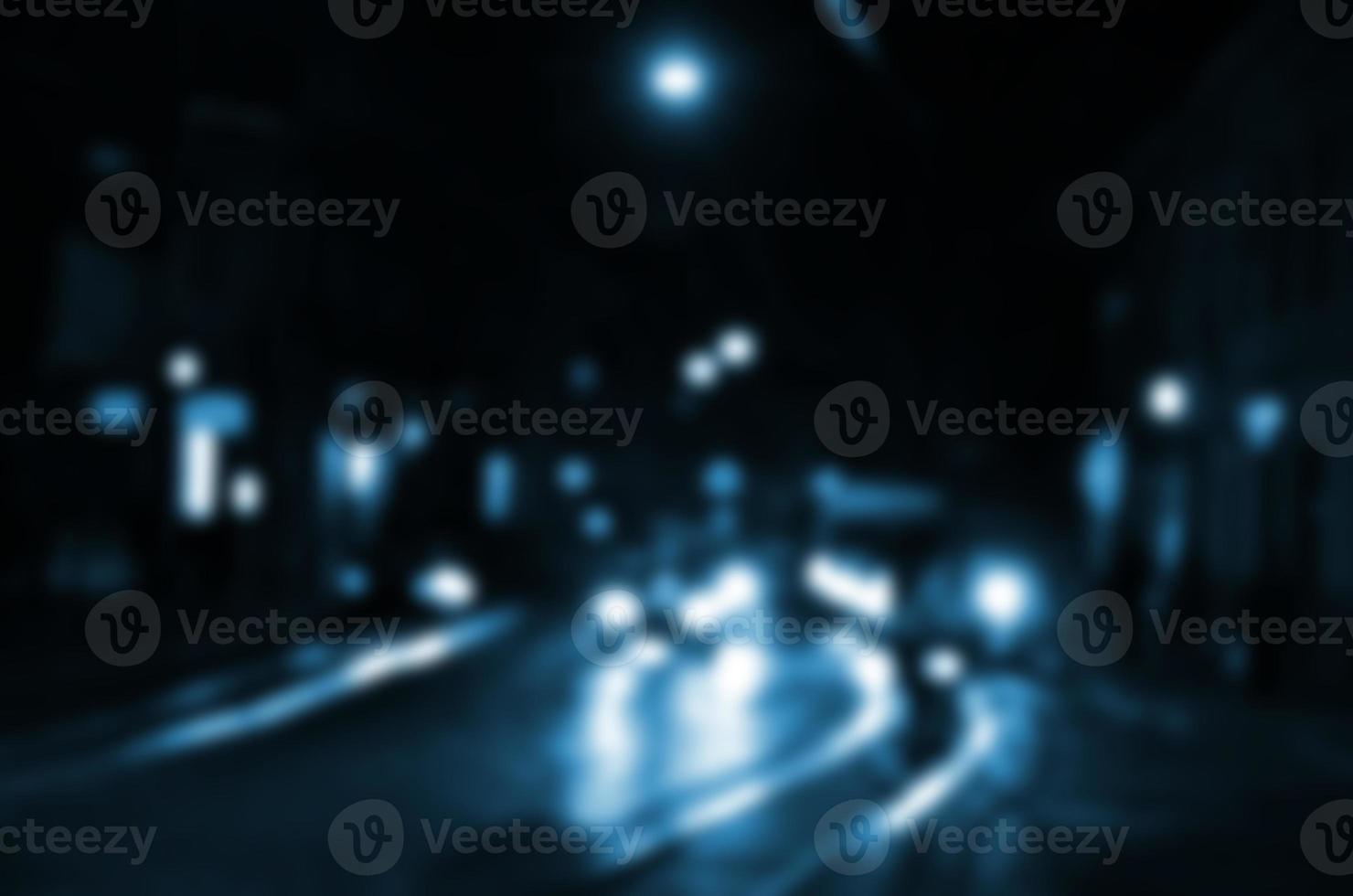 Blurred night scene of traffic on the roadway. Defocused image of cars traveling with luminous headlights. Bokeh Art photo