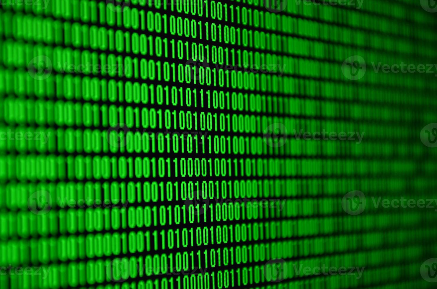 An image of a binary code made up of a set of green digits on a black background photo