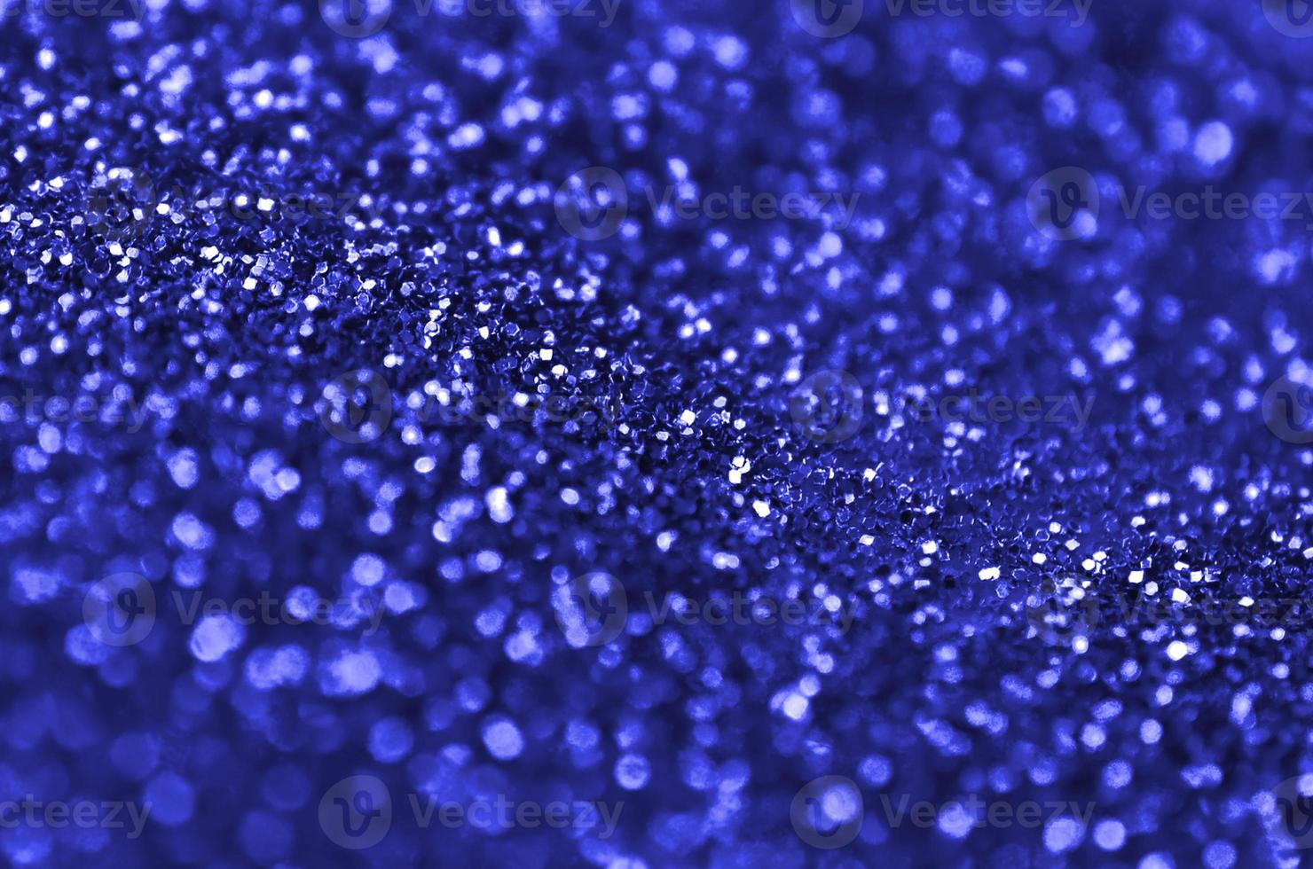 Blue decorative sequins. Background image with shiny bokeh lights from small elements photo