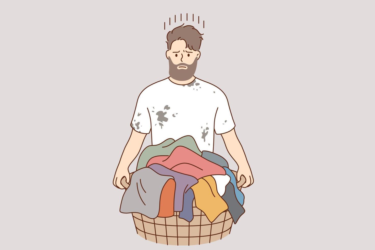 concepto de lavandería y lavado de ropa. joven personaje de caricatura de hombre frustrado y estresado de pie y sosteniendo una canasta con ropa sucia de colores para la ilustración de vector de lavandería