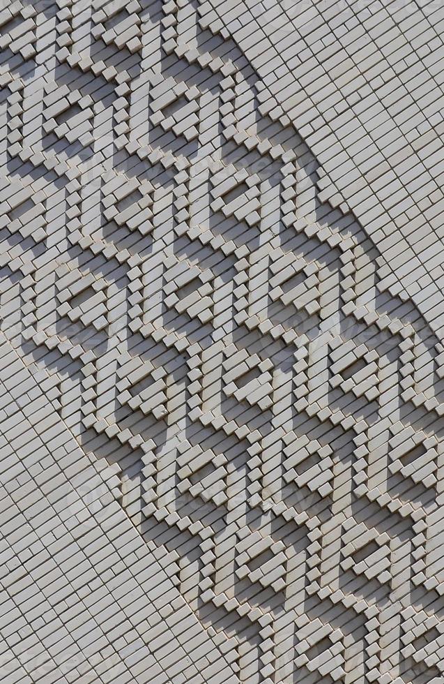 A pattern made of white bricks in the form of diamond shapes. Decoration of the walls during the Soviet Union photo