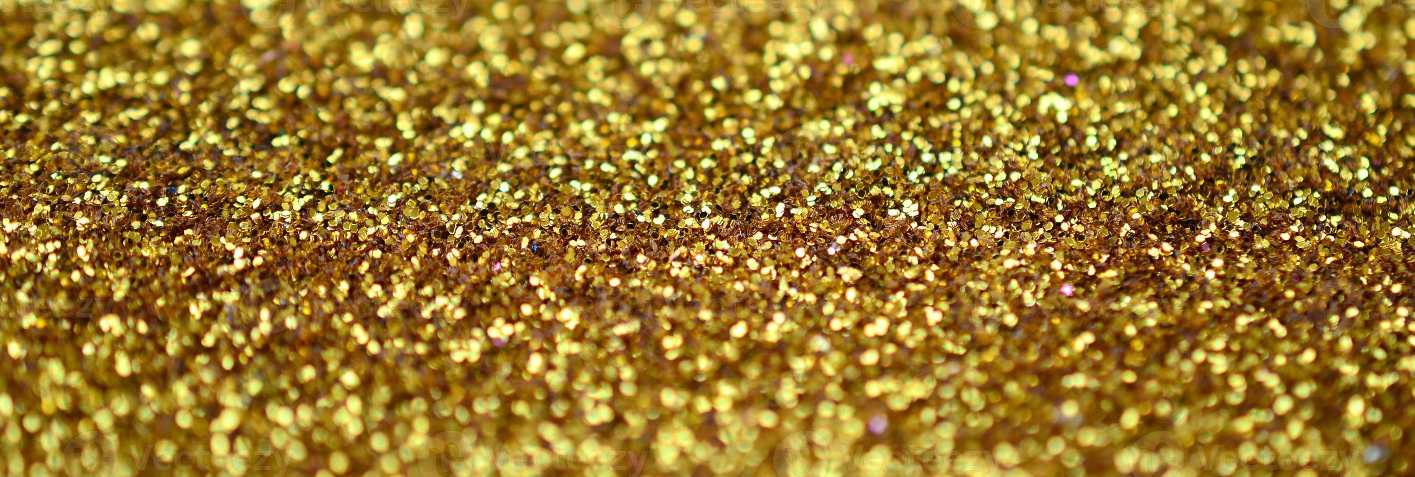 Orange decorative sequins. Background image with shiny bokeh lights from small elements photo