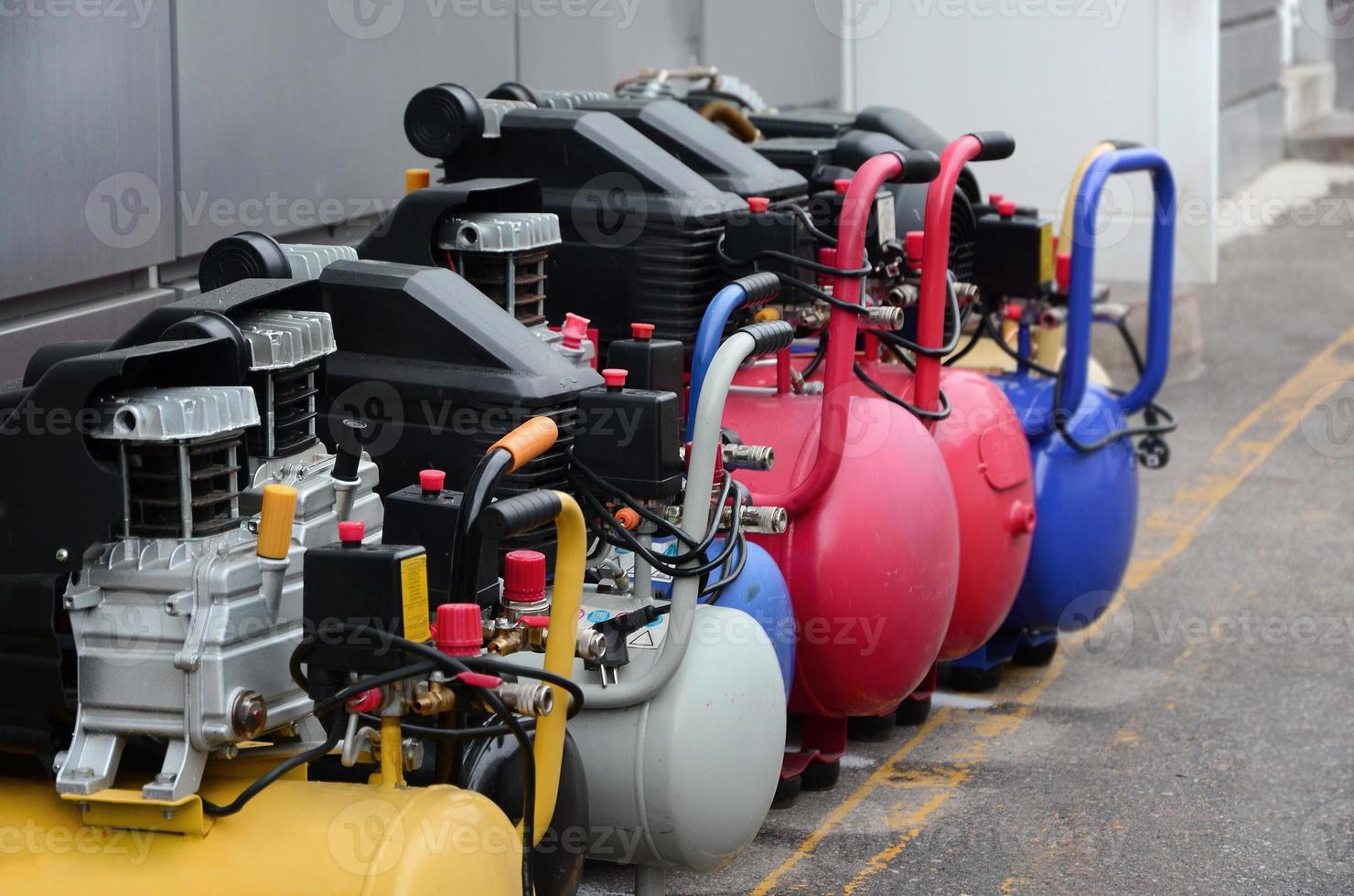 Many new air compressors pressure pumps close up photo