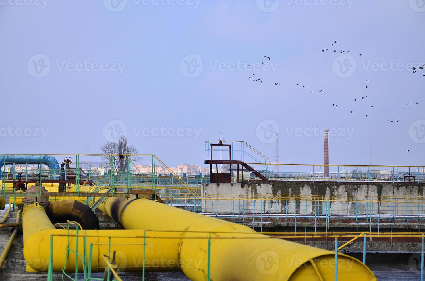 Industrial space with lots of pipes and communications photo