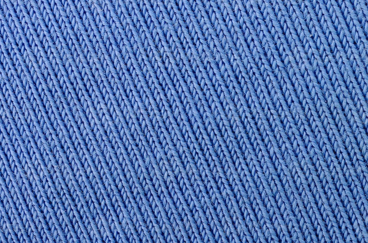 The texture of the fabric in blue color. Material for making shirts and blouses photo