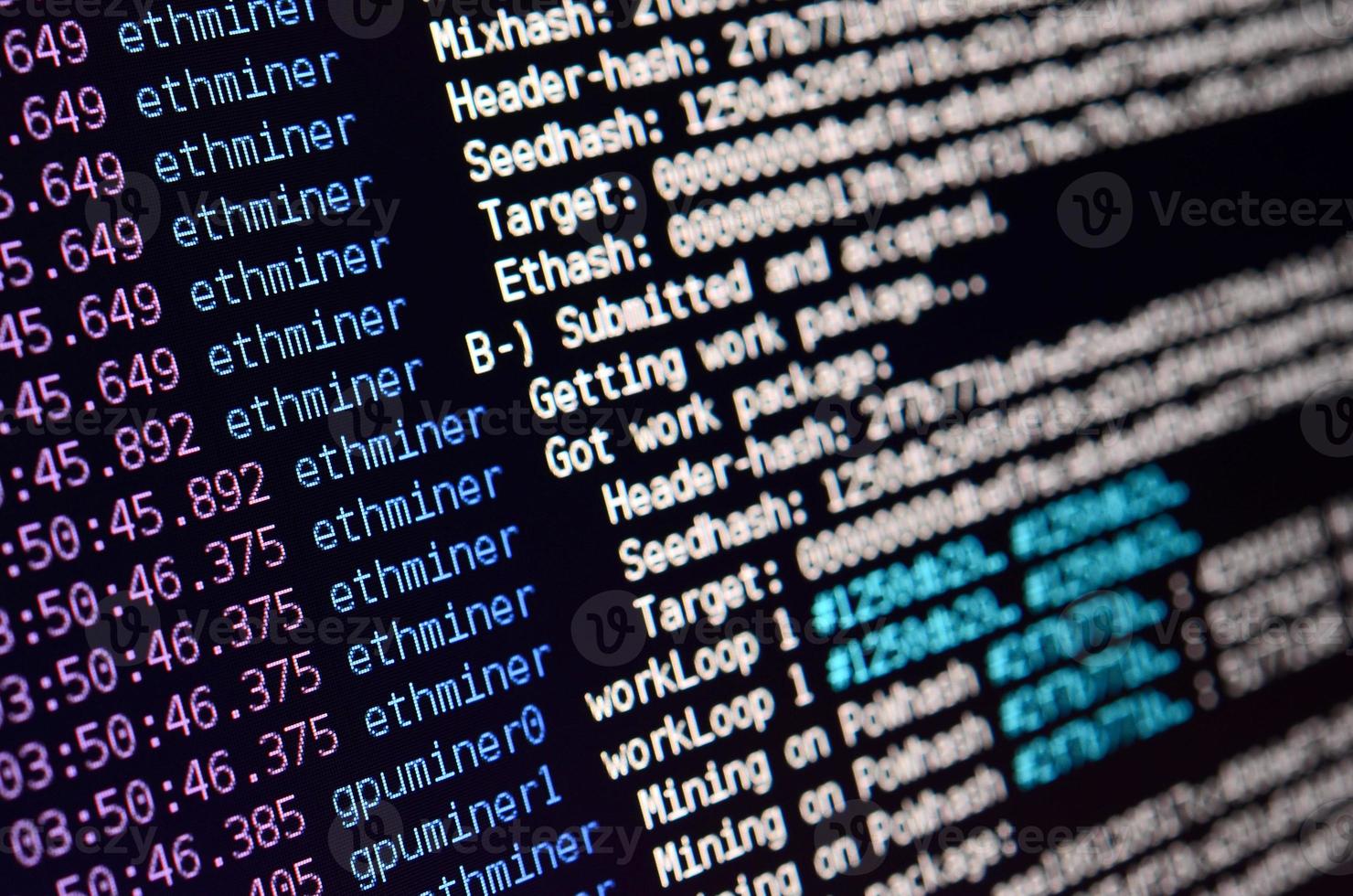 Macro snapshot of the program interface for crypto currency mining on the monitor of an office computer. The concept of mining bitcoins. The flow of information strings and data photo