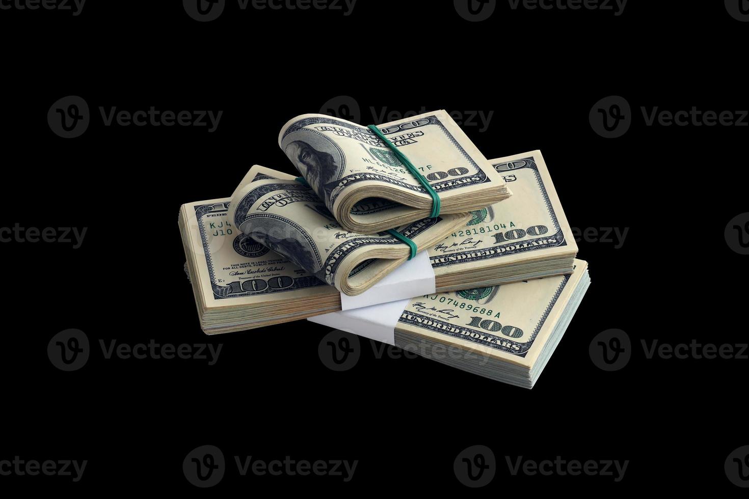 Bundle of US dollar bills isolated on black. Pack of american money with high resolution on perfect black background photo