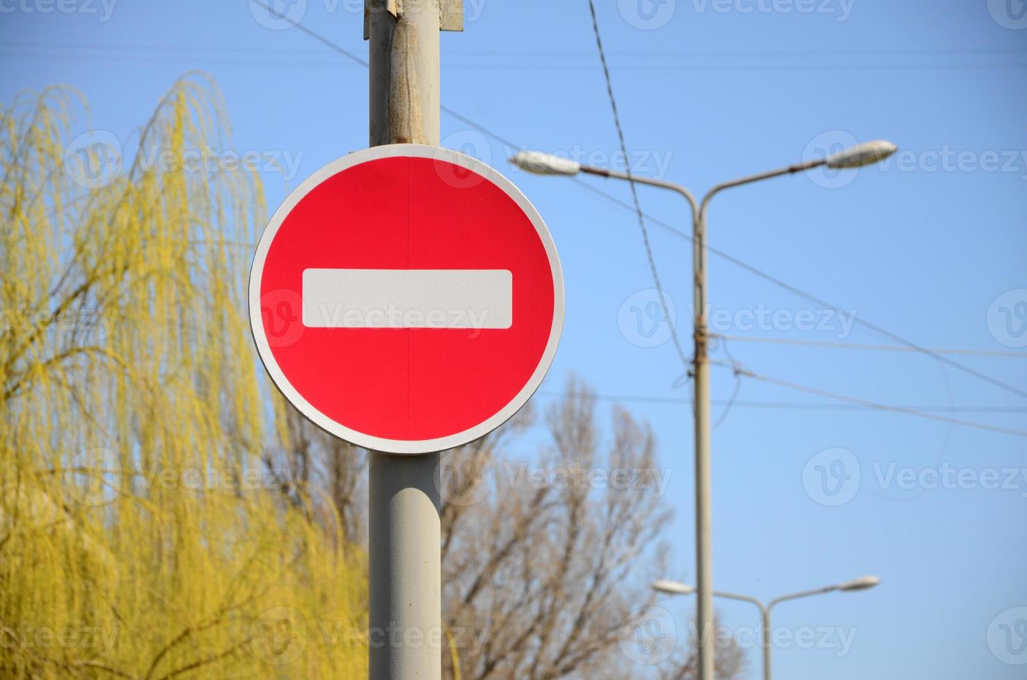 Road sign in the form of a white rectangle in a red circle. No entry photo