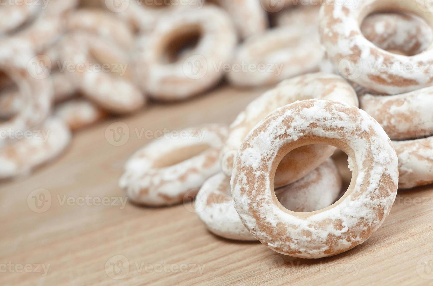 Glazed bagels on wooden table photo