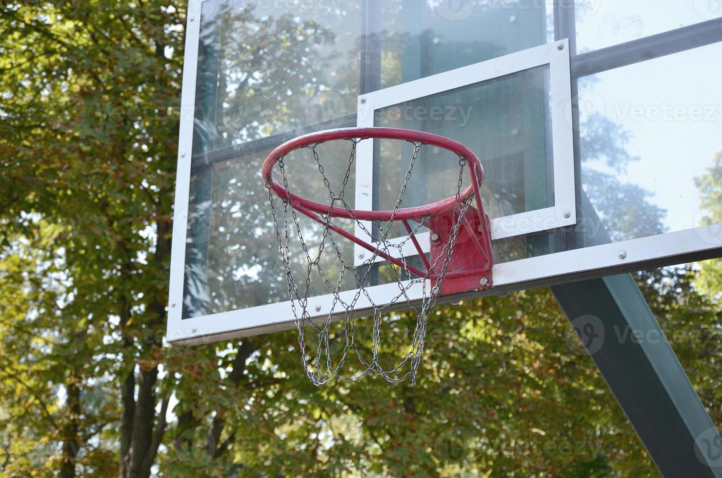 Outdoor Basketball backboard with clear blue sky photo