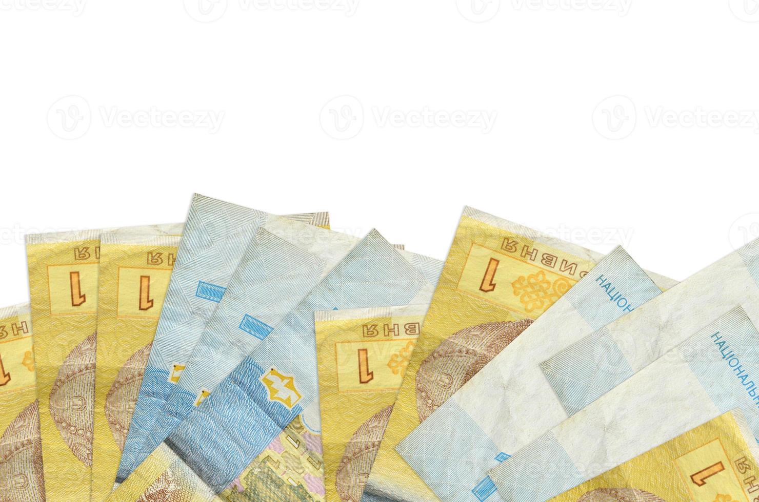 1 billete de hryvnia ucraniano se encuentra en la parte inferior de la pantalla aislado en fondo blanco con espacio de copia. plantilla de banner de fondo foto