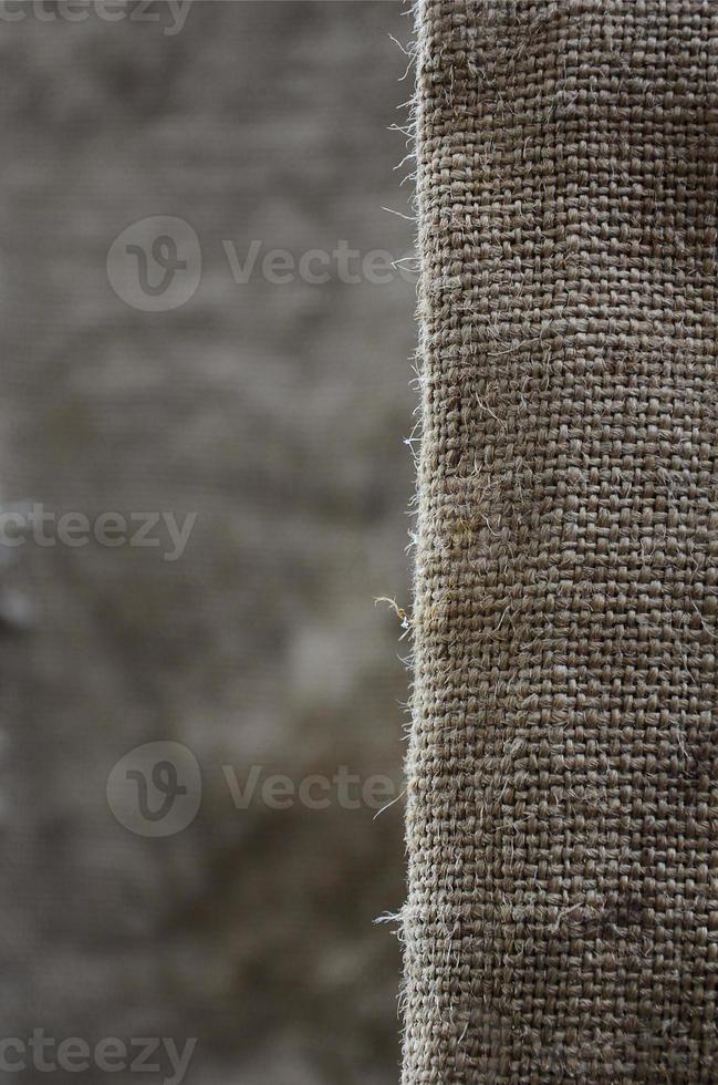 The texture of a very old brown sack cloth. Retro texture with canvas material. Background image with copy space photo