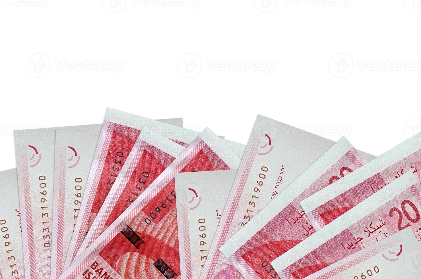 20 Israeli new shekels bills lies on bottom side of screen isolated on white background with copy space. Background banner template photo