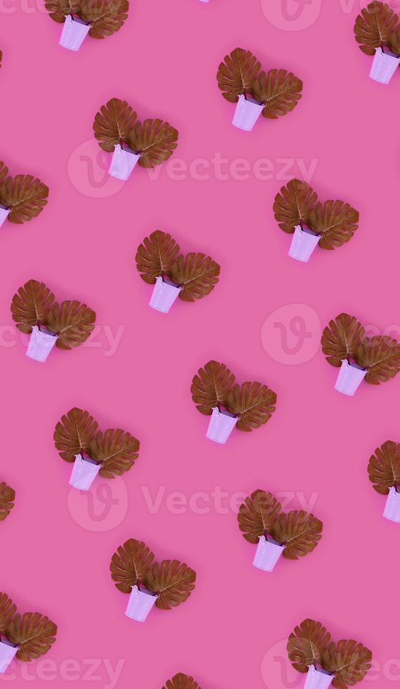 Tropical palm monstera leaves lies in a pastel pails on a colored background. Flat lay trendy minimal pattern. Top view photo