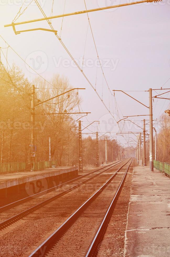 A railway station with platforms for waiting for trains photo