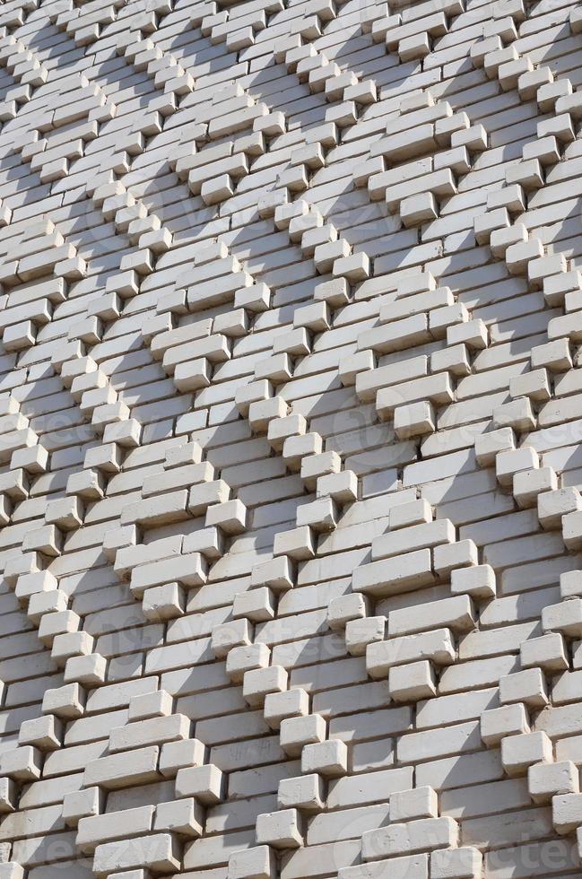 A pattern made of white bricks in the form of diamond shapes. Decoration of the walls during the Soviet Union photo