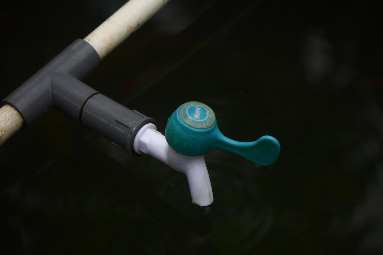 photo of the water faucet in the blue pool