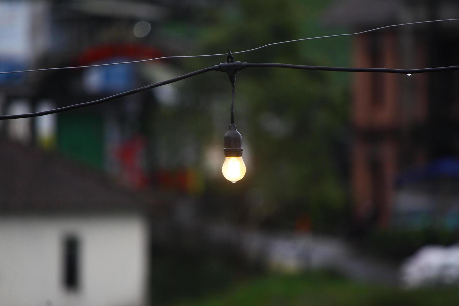 photo of a small lamp hanging in the afternoon