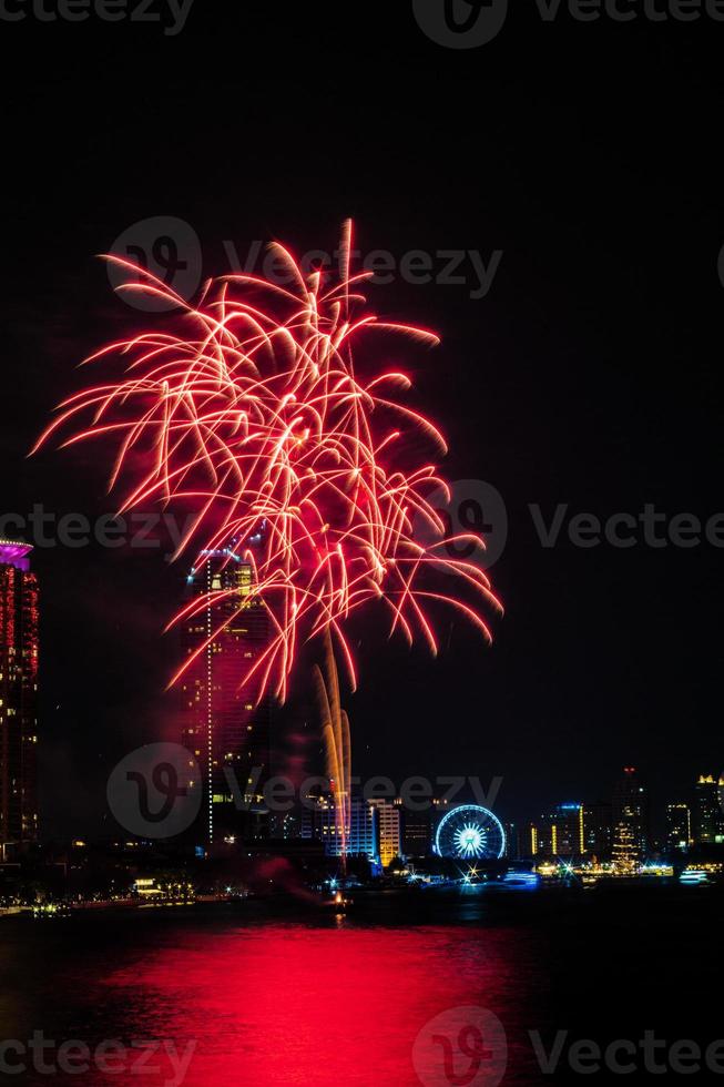 fireworks on the river in the dark sky photo