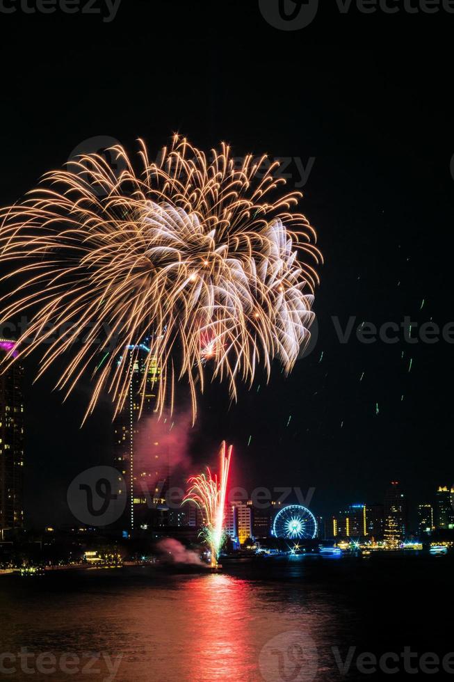 fireworks on the river in the dark sky photo