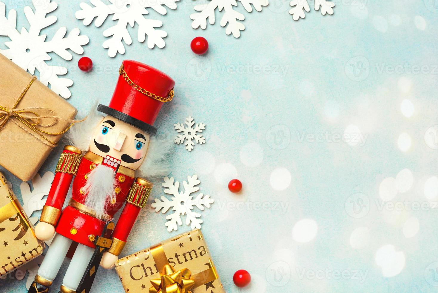 Christmas concept background. Top view of Christmas ornament and christmas wooden nutcracker toy solider with space for text photo