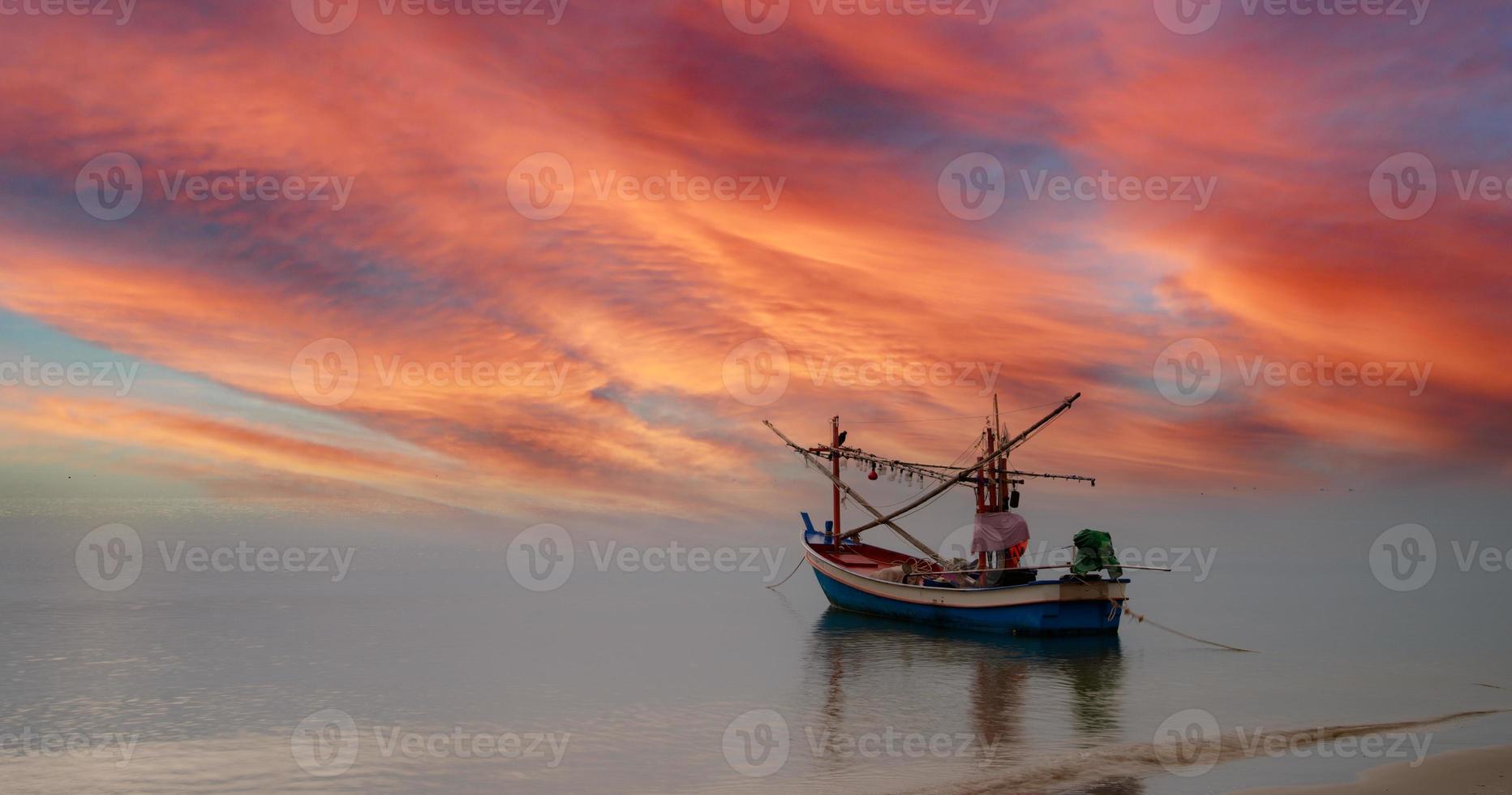 A boat in the evening sea. photo
