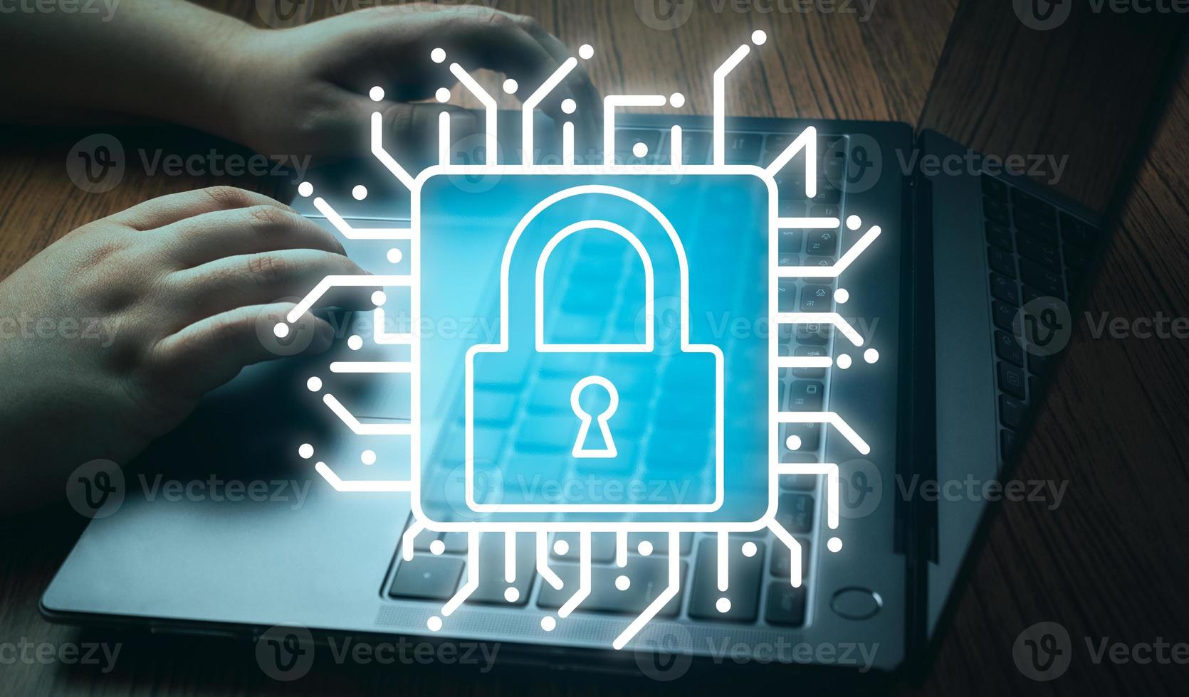 Cyber security network concept. Background of hands typing on laptop with flare light effect and security lock graphic. Digital Data Protection. Defense against danger. photo