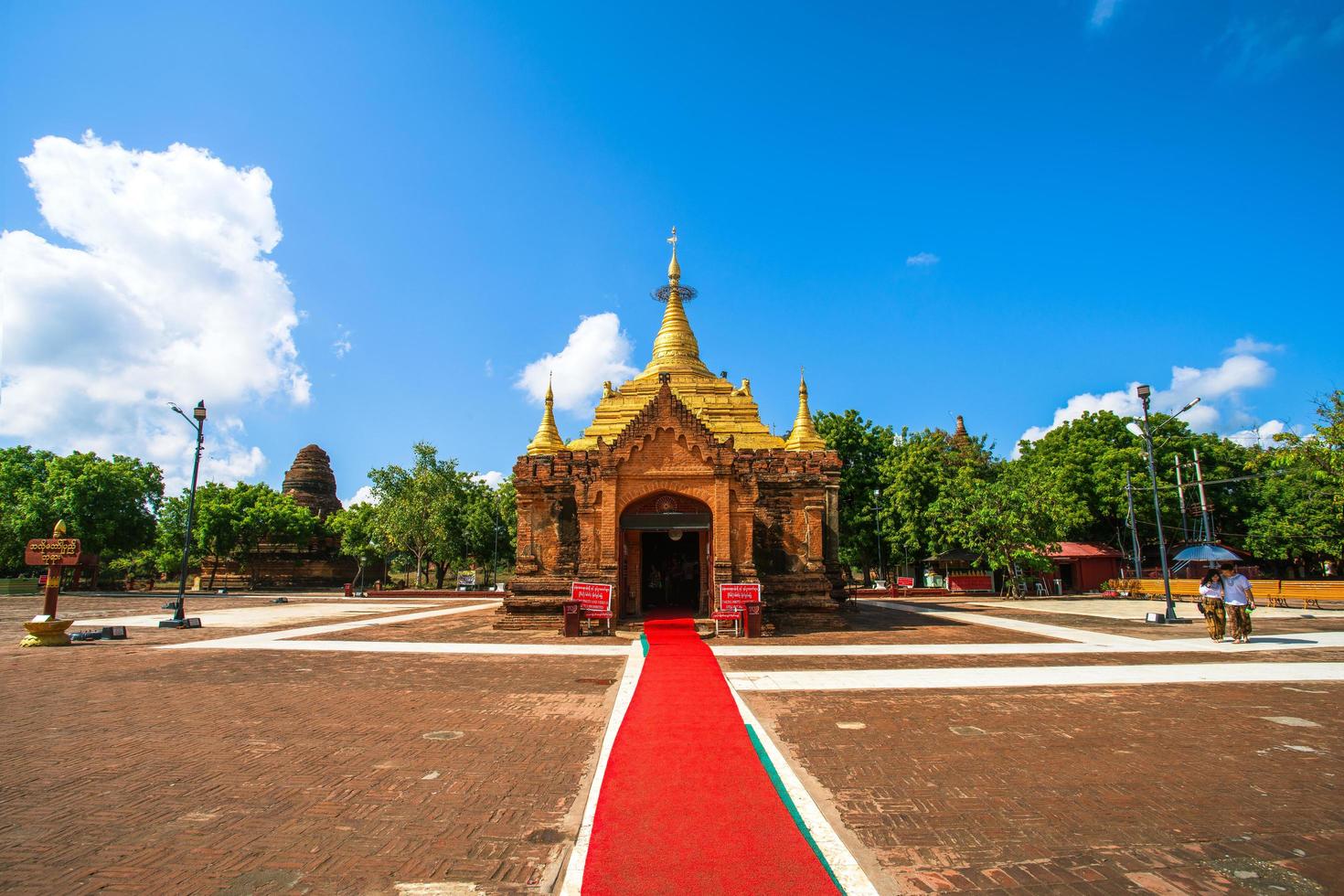 Bagan, Mandalay region, Myanmar - January 9, 2019 - Tourists visit to see and pray to the ancient pagodas in old Bagan photo