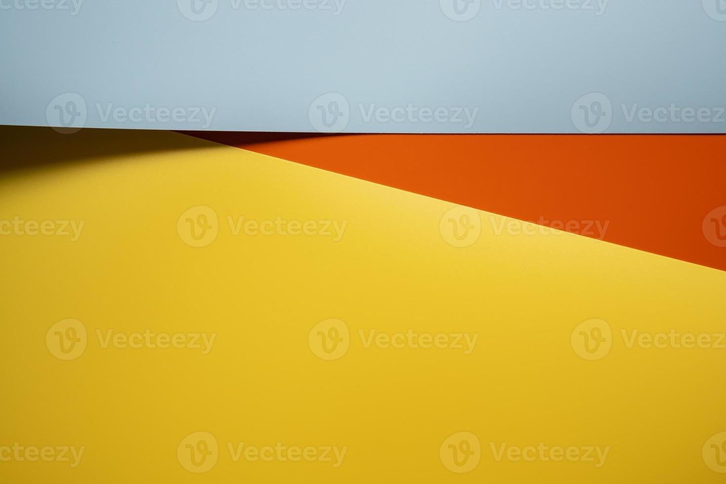 Abstract background in yellow, red and gray colors with shadow. Copy space. Top view. photo