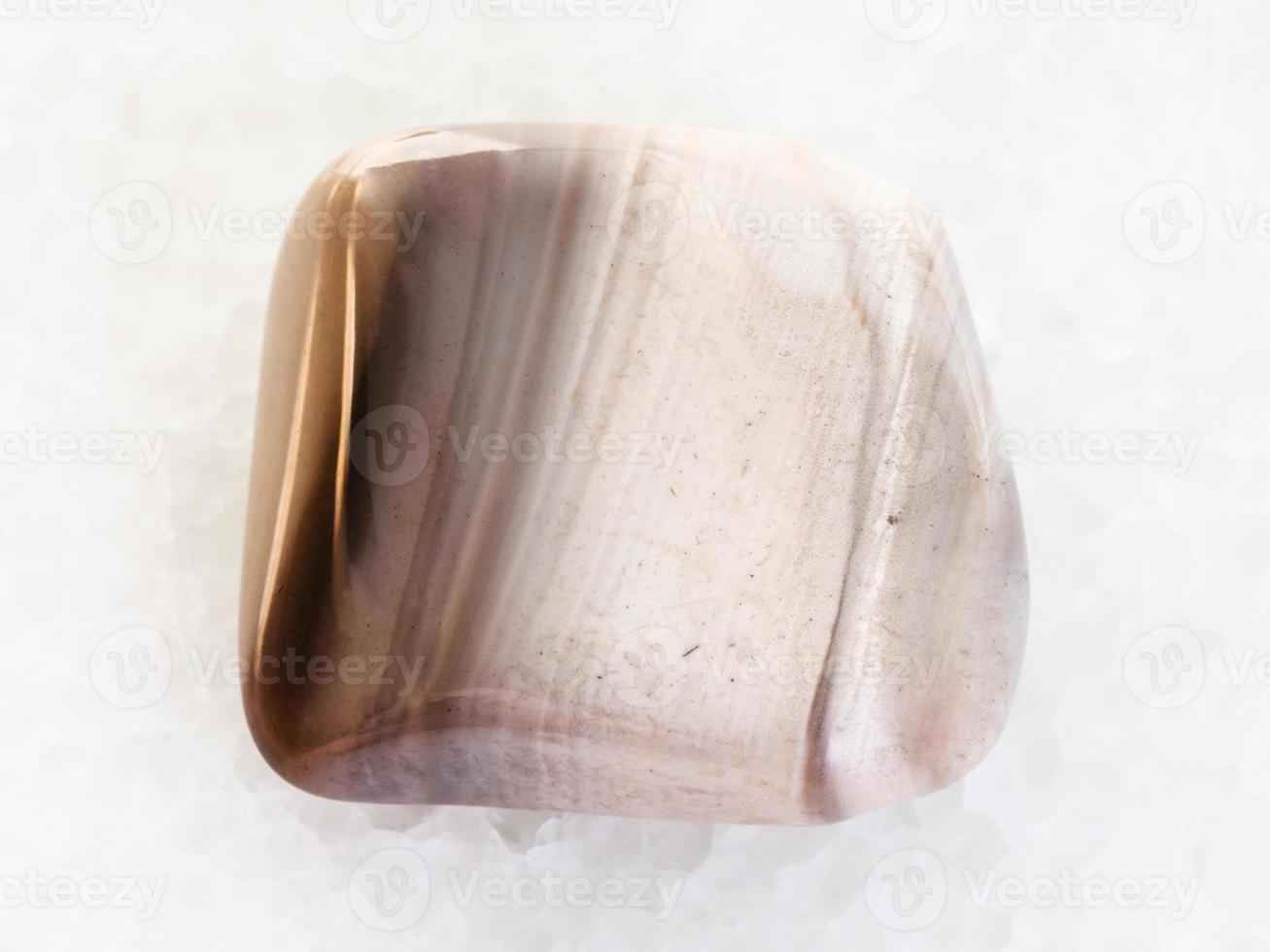 polished flint stone on white marble 13931782 Stock Photo at Vecteezy