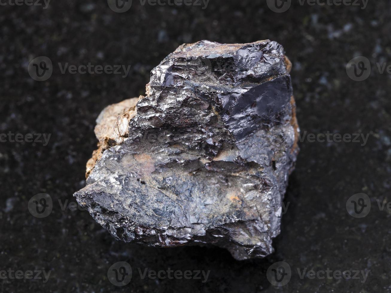 rough ilmenorutile Nb-bearing rutile on dark photo