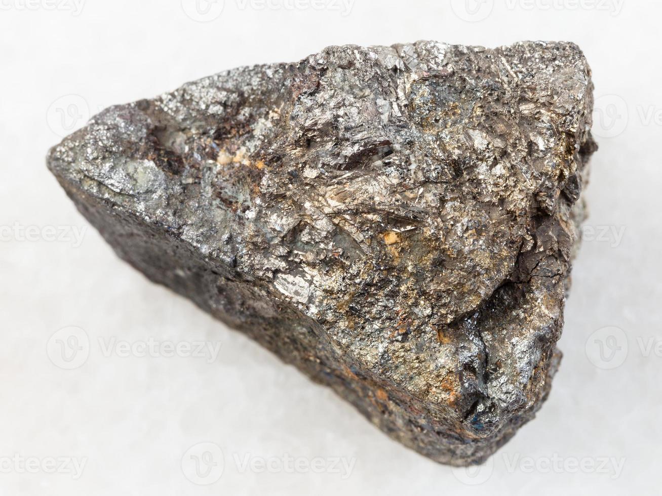 raw Arsenopyrite stone on white marble photo